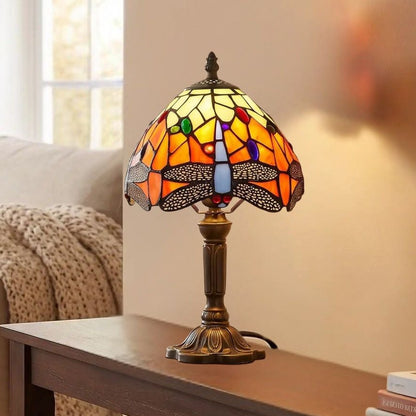 Lampes à poser console vu rapproche style tiffany vitrail orange avec motifs de libellules