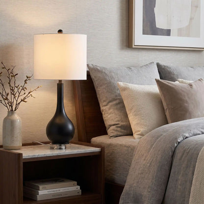 lampe de chevet design noir sur table chevet base cristal et metal dore