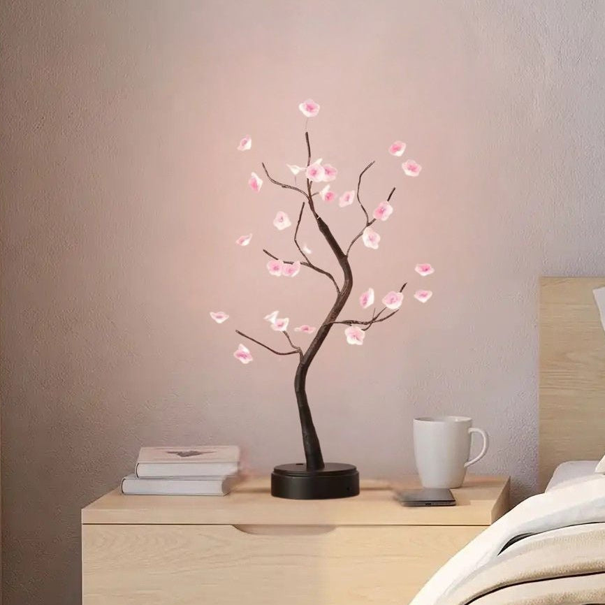 lampe de chevet sur table chevet chambre vu rapproche fleurs de prunier rose led
